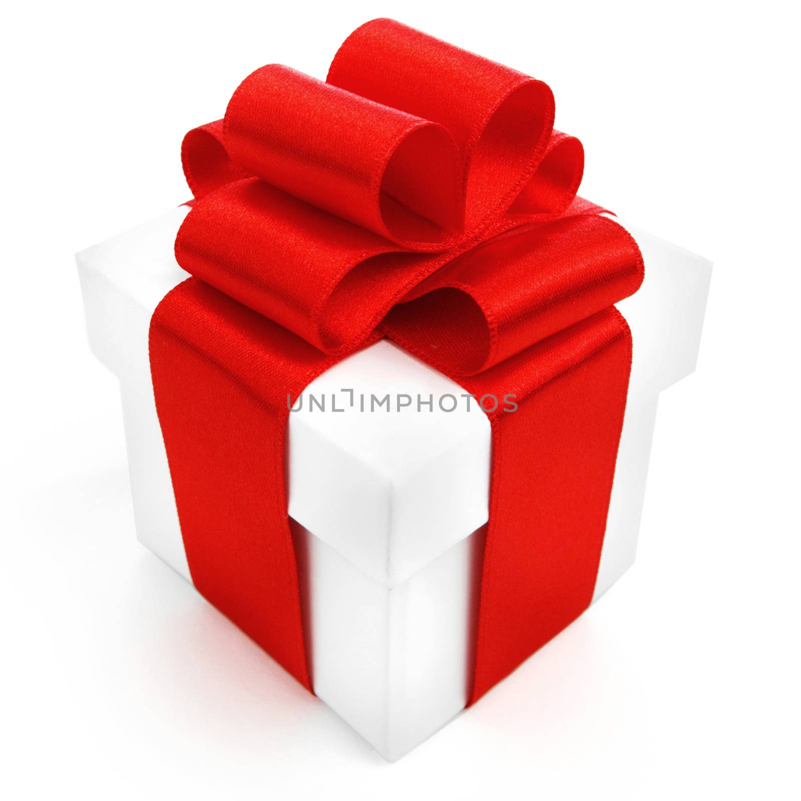 White gift box with red ribbon isolated on white background