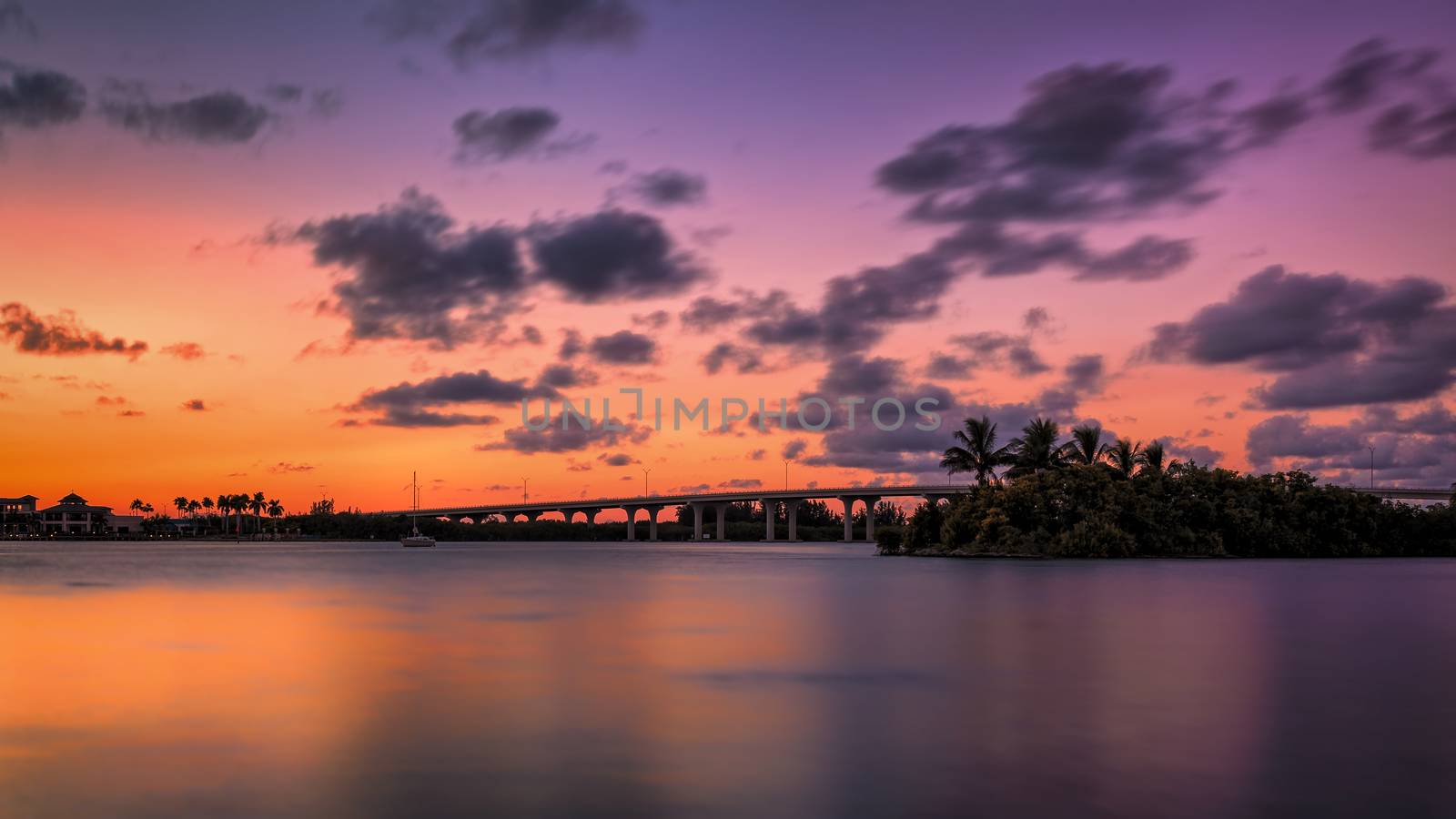 A Florida Bridge and a Colorful Sunset by backyard_photography