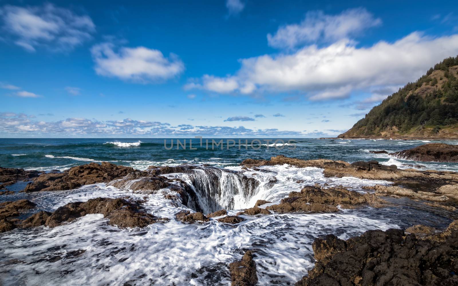 A stormy day at Thor's Well, central Oregon, USA. Color Image.