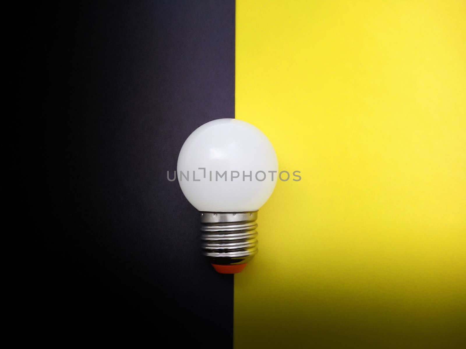 Light Bulb Simulating On and Off on Colored Paper