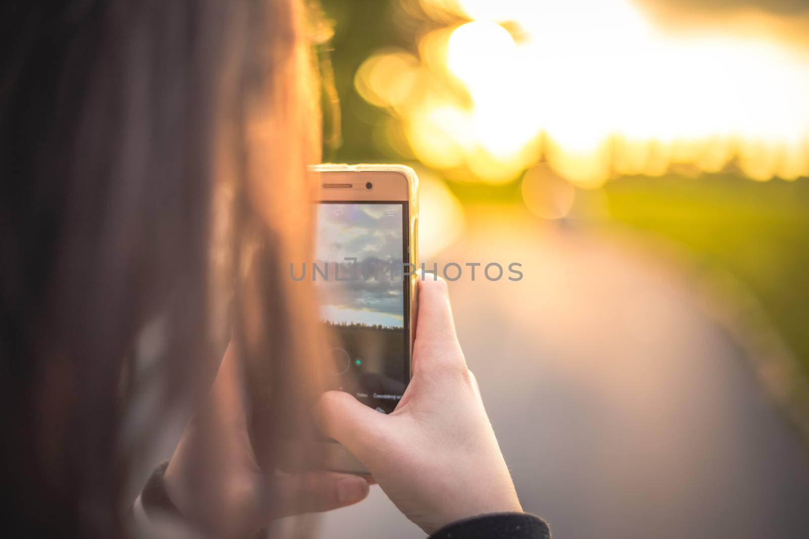 Woman taking pictures with her smartphone