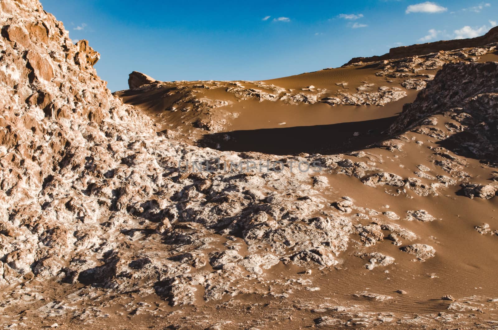 Rocky dunes and dark brown sand in Atacama desert. Chile by mikelju