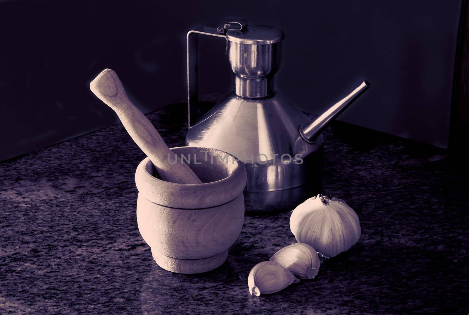 Ingredients of garlic sauce, vintage color, steel jug with olive oil, garlic head, garlic cloves, mortar and pestle