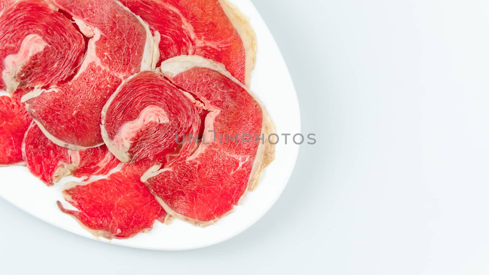 raw beef on a plate 
 by rakratchada