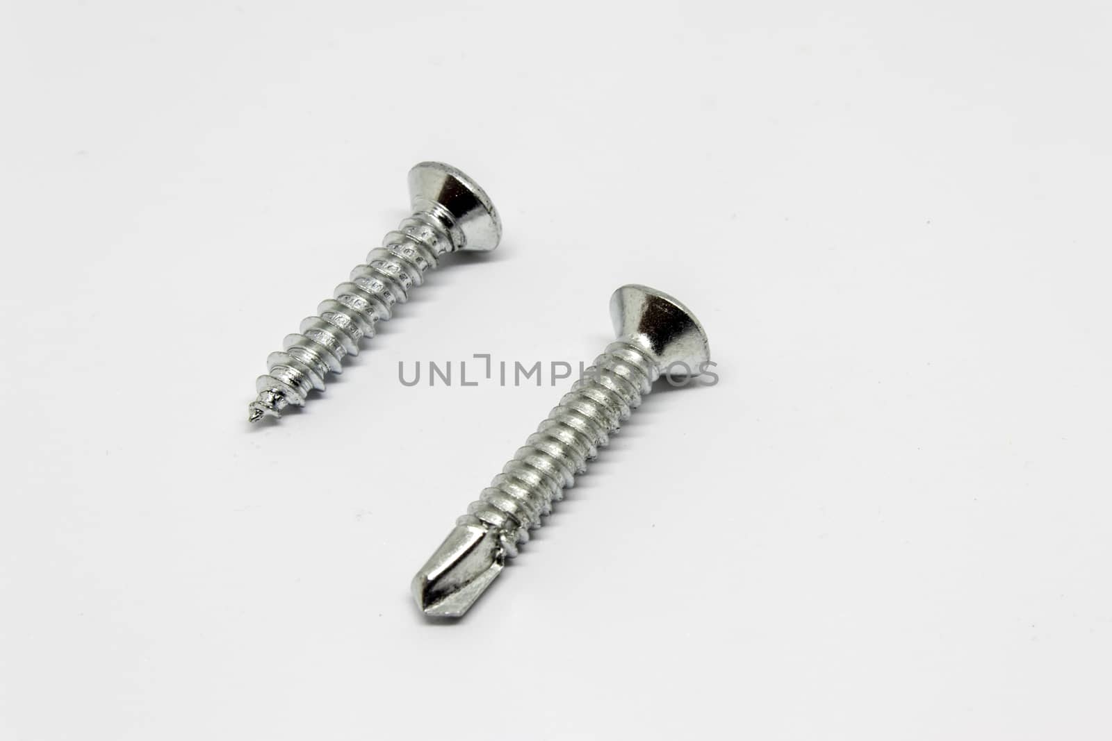 isolated two metal screw with white background.can be used as product photo.