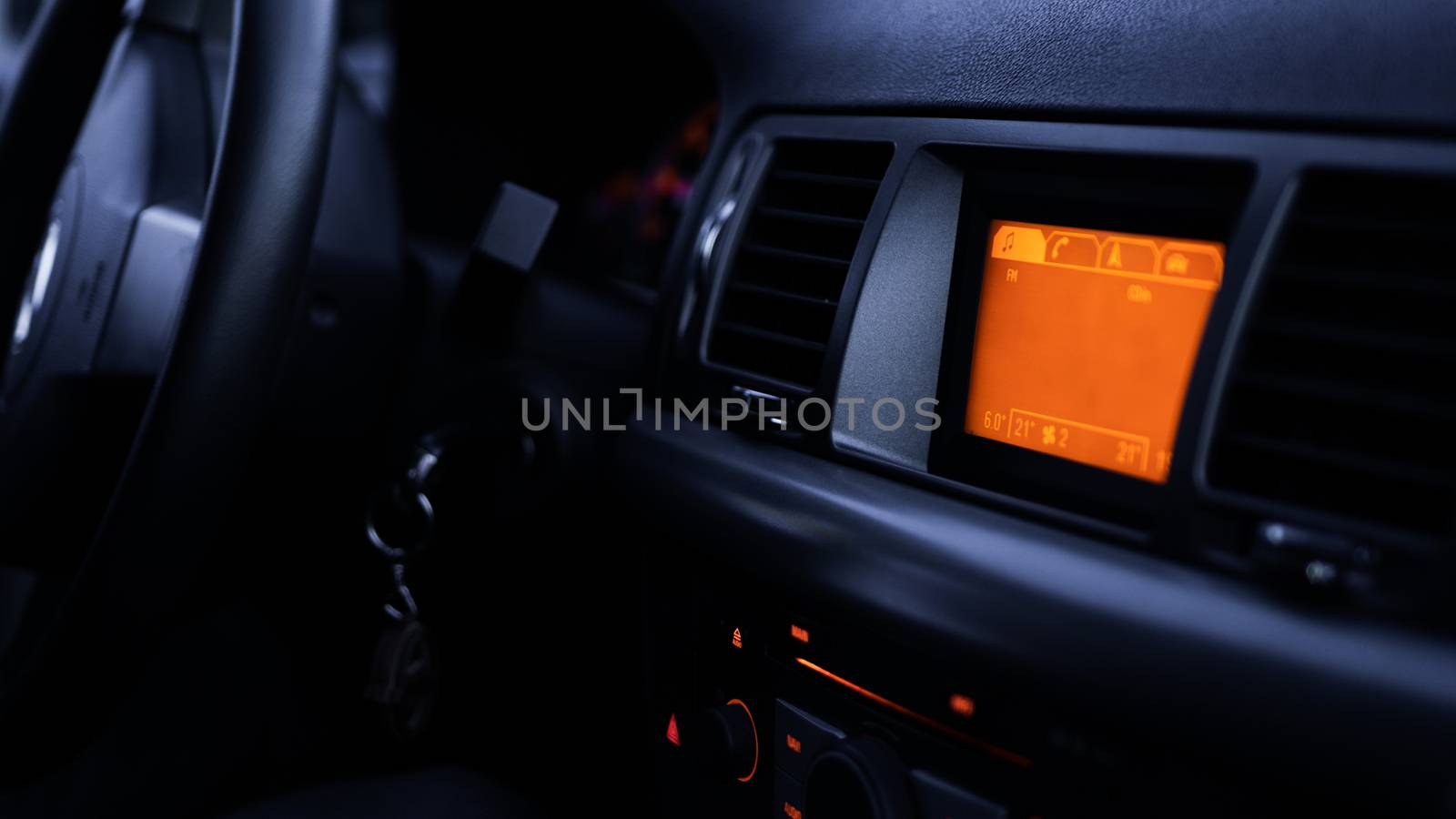 Buttons of radio, dashboard, climate control in car close up by natali_brill