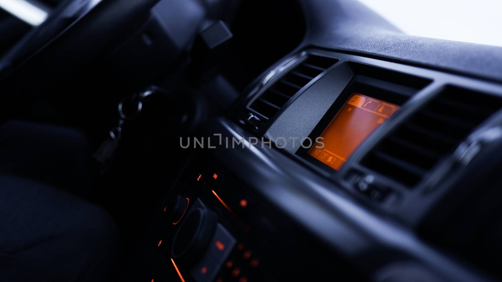 Buttons of radio, dashboard, climate control in car close up by natali_brill