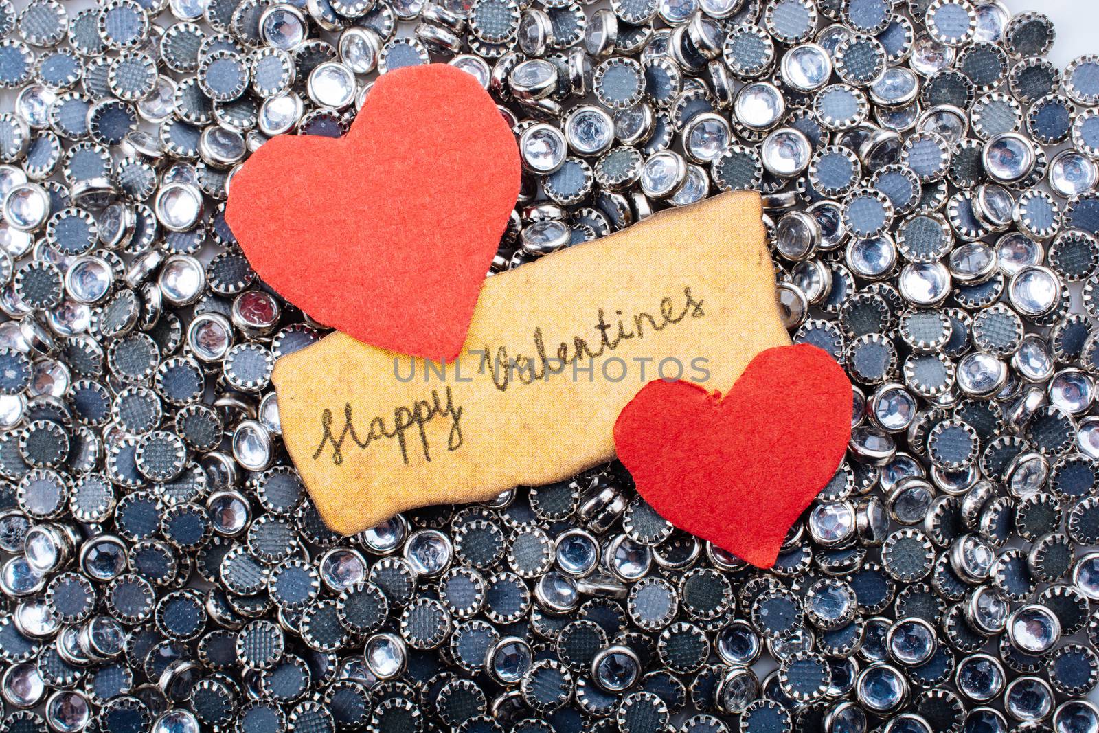 Love icon and Valentine's day wording on torn paper