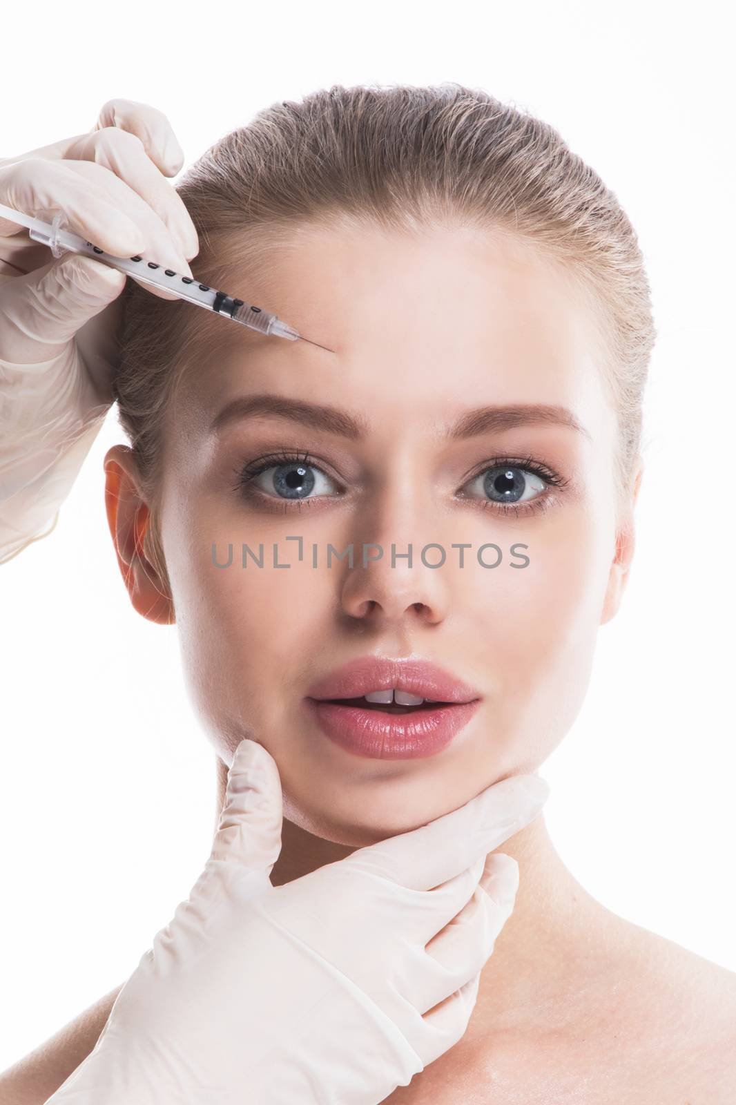 Cosmetic injection to female face isolated on white background