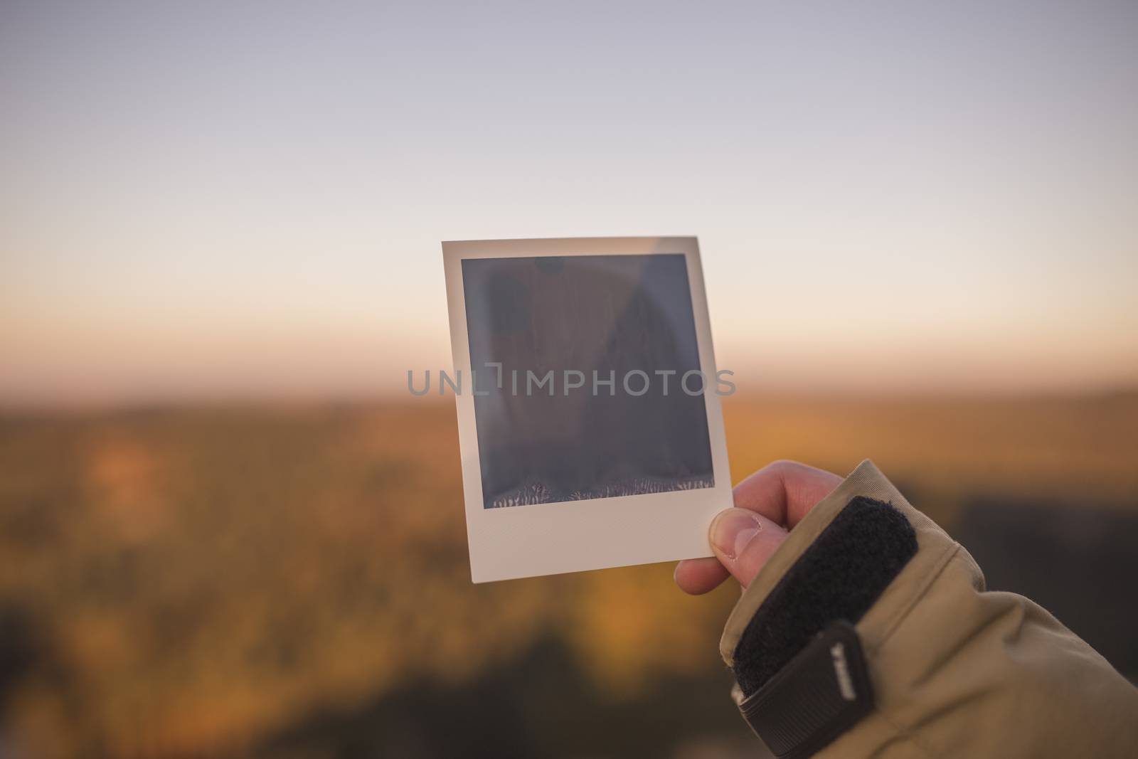 Hand holding blank Instant Photo