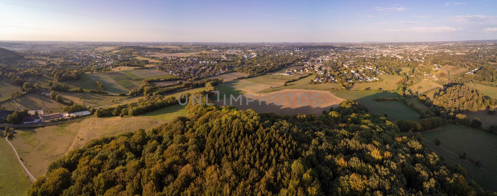 Aerial panorama of meadows and forrests next to the West German city Aachen in the Eifel region