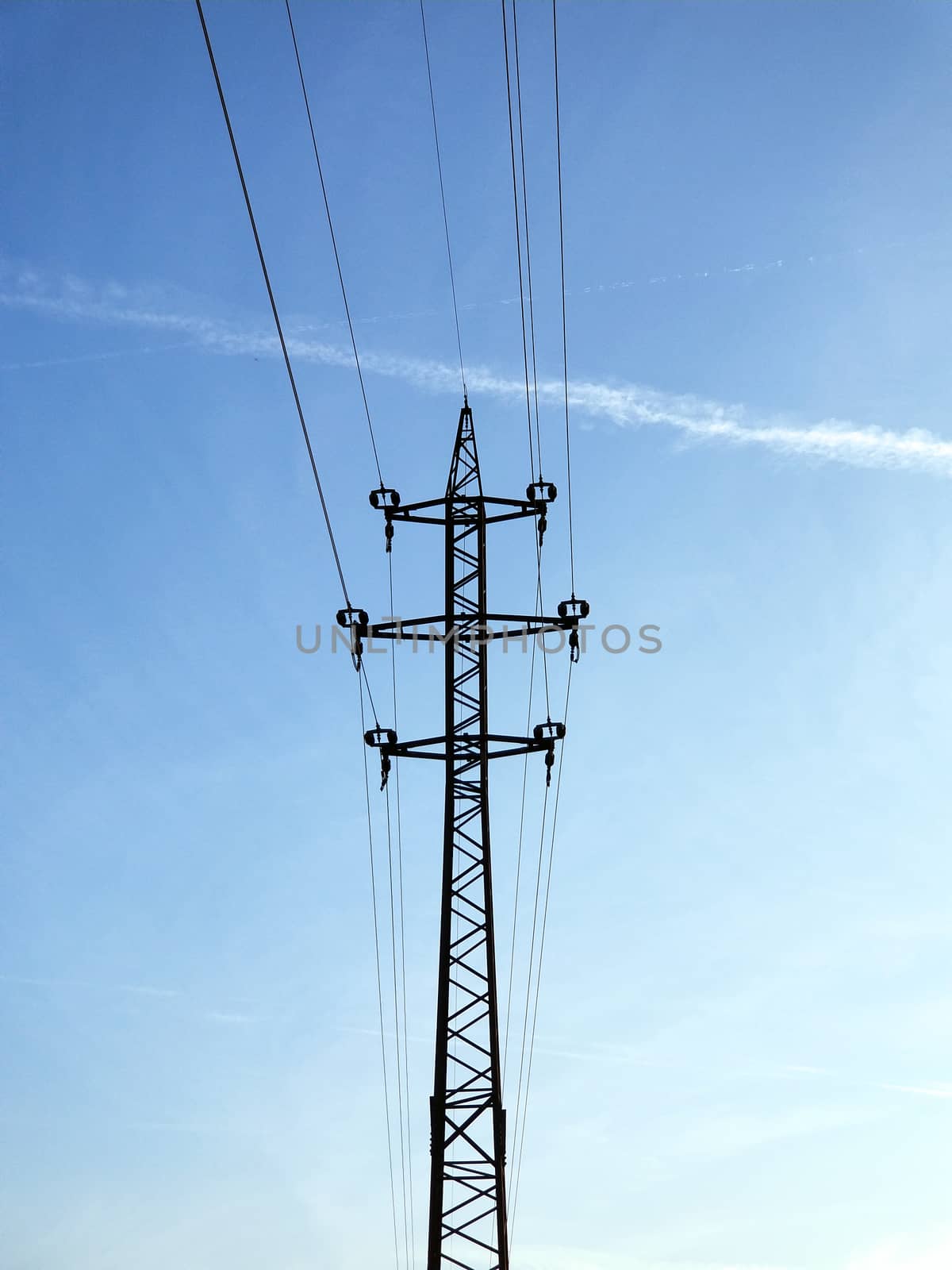 High-voltage lines and cables onthe blue sky background.