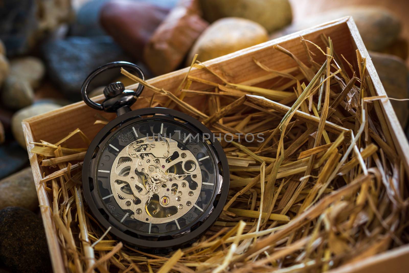 Pocket watch winder on natural wheat straw in a wooden box. Conc by SaitanSainam