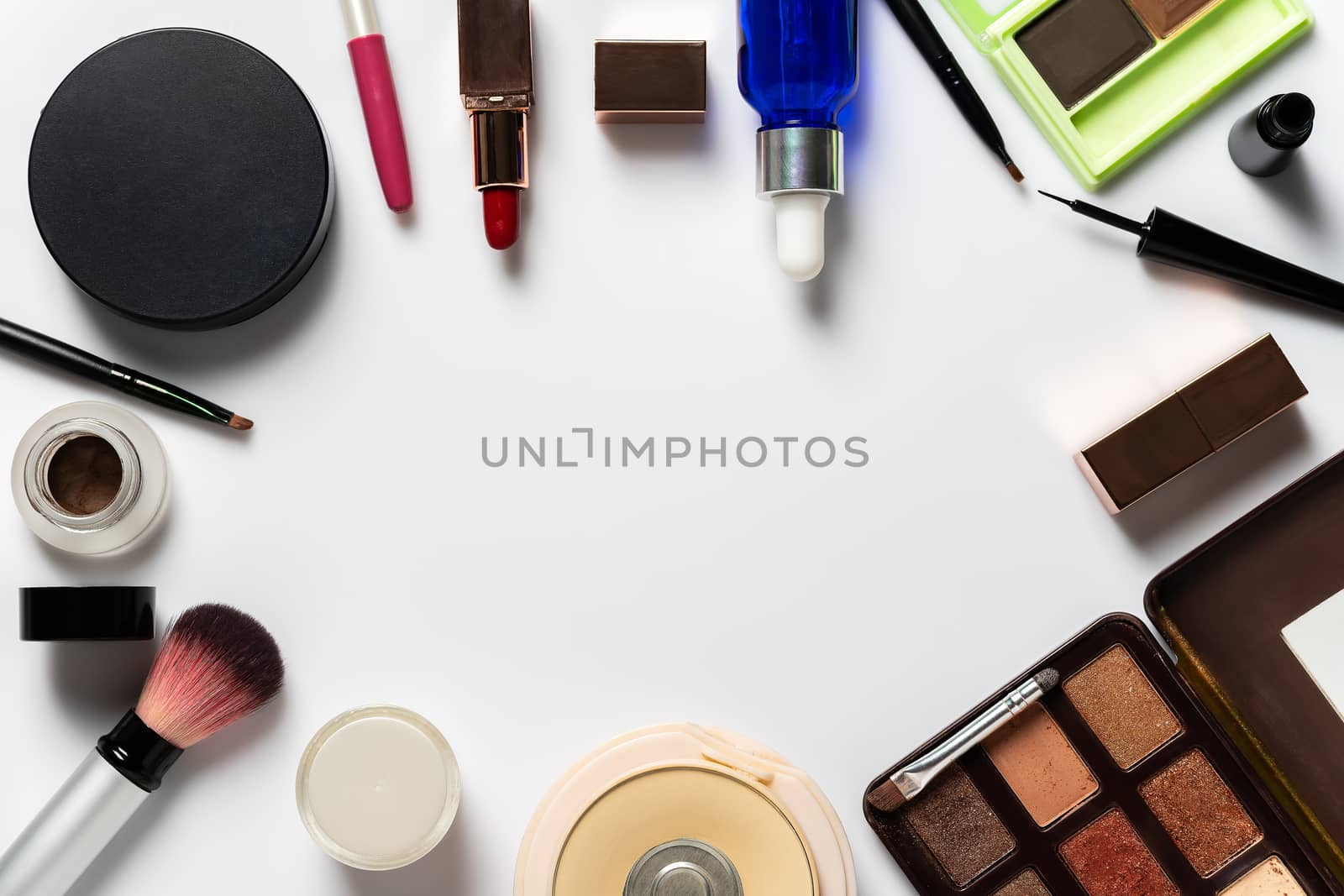 Many cosmetics for makeup and beauty of women on white background. Copy space for text or articles about beauty.