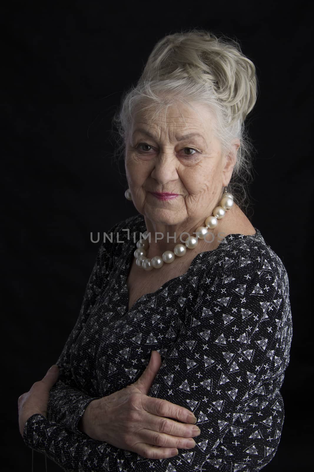 A very old woman. An eighty-year-old woman. Studio portrait of an old woman