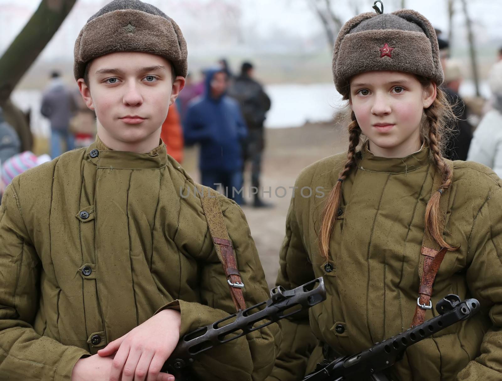 boy and girl in clothes guerrillas vkrasnoy Army WWII.Children of the Second World War