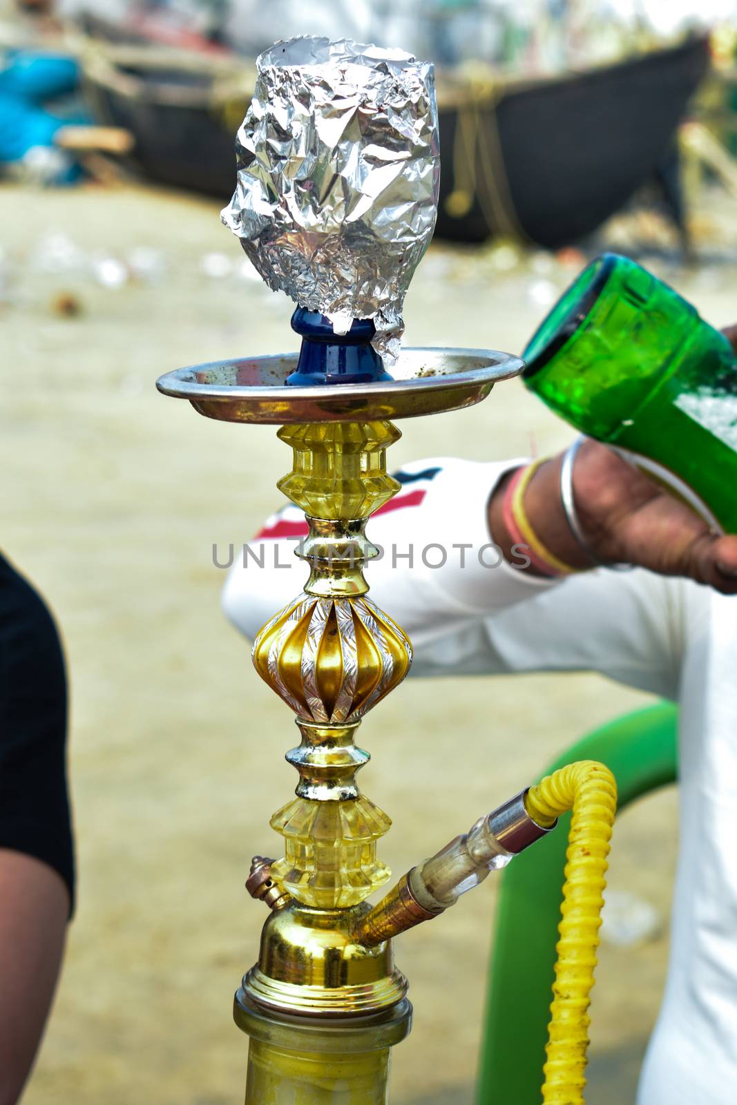 A traditional Hookah in metal bowl for Shisha Smoking. Day Lights background, Close up.