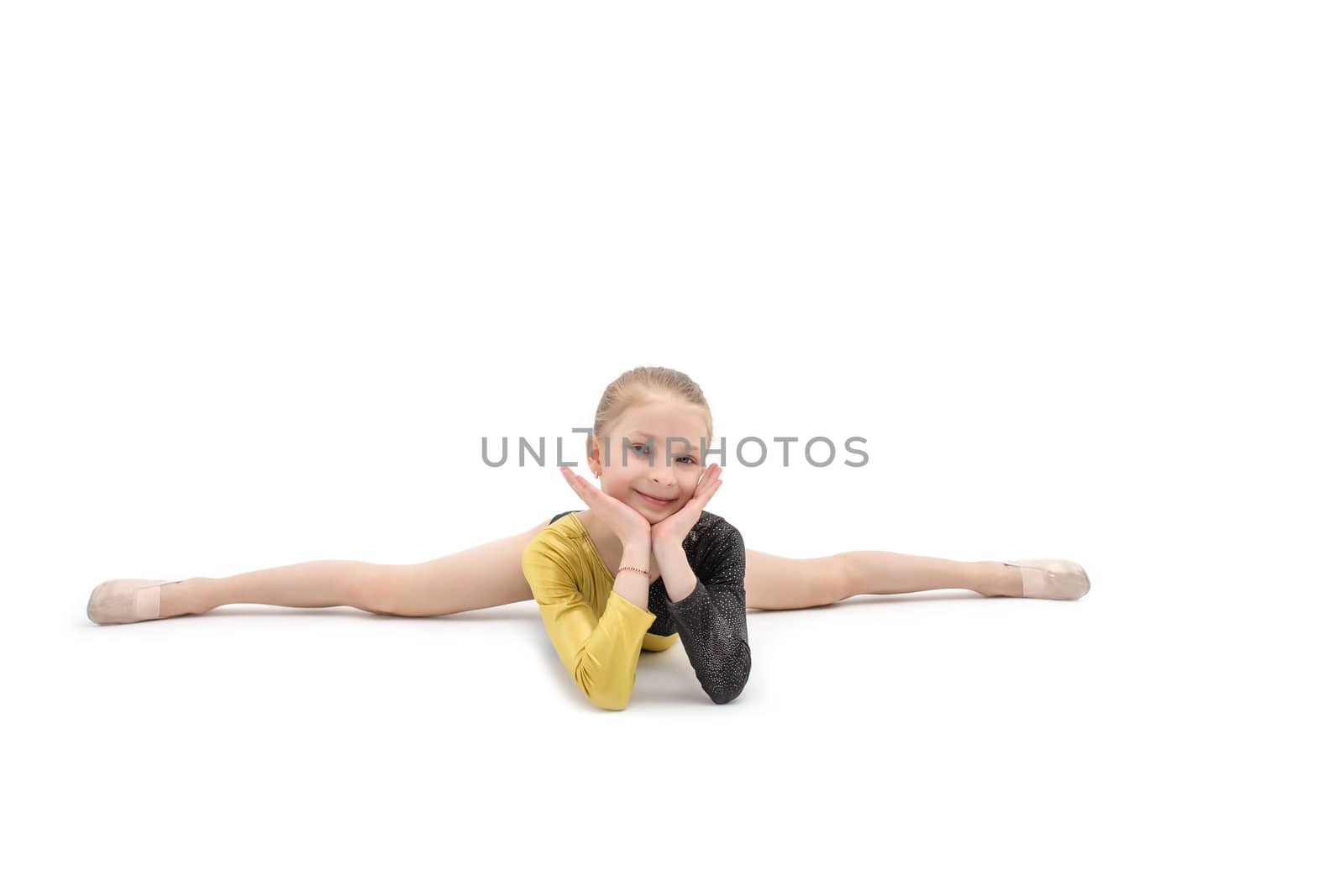 Acrobatics teenage girl sitting in cross split isolated on white