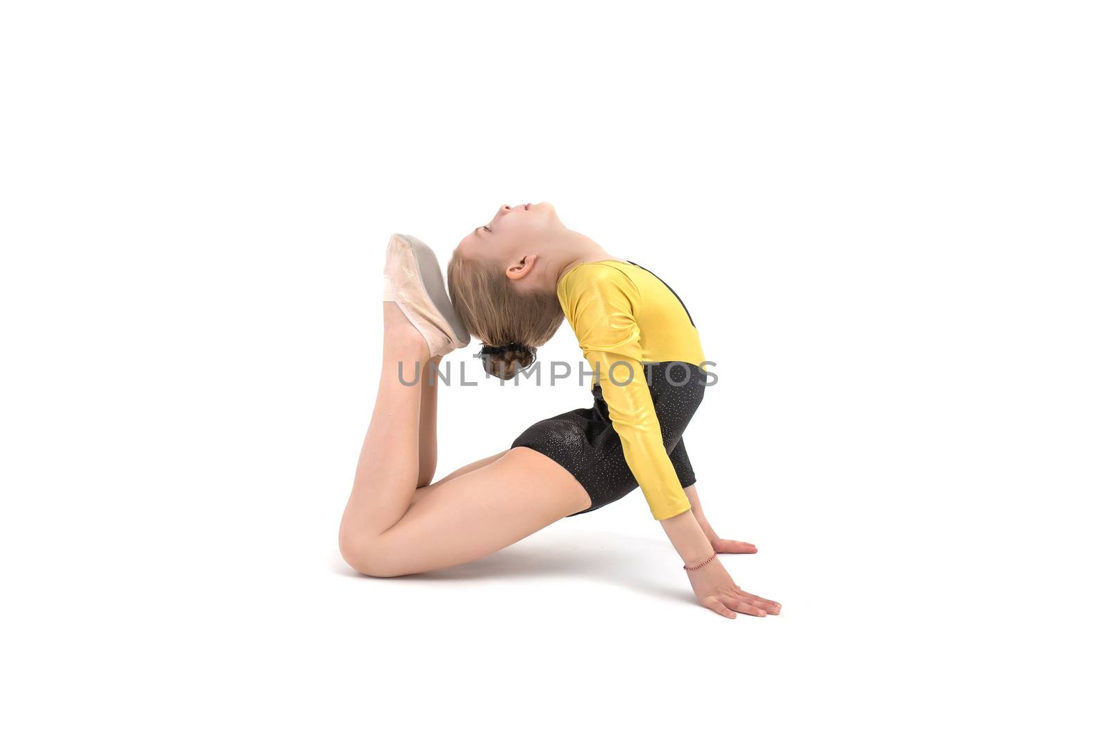 Teenager acrobatic girl making backbend isolated on white
