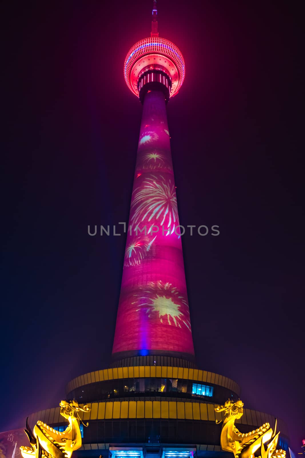 The Central Radio and Television Tower at night with colorful illumination, Beijing, China.