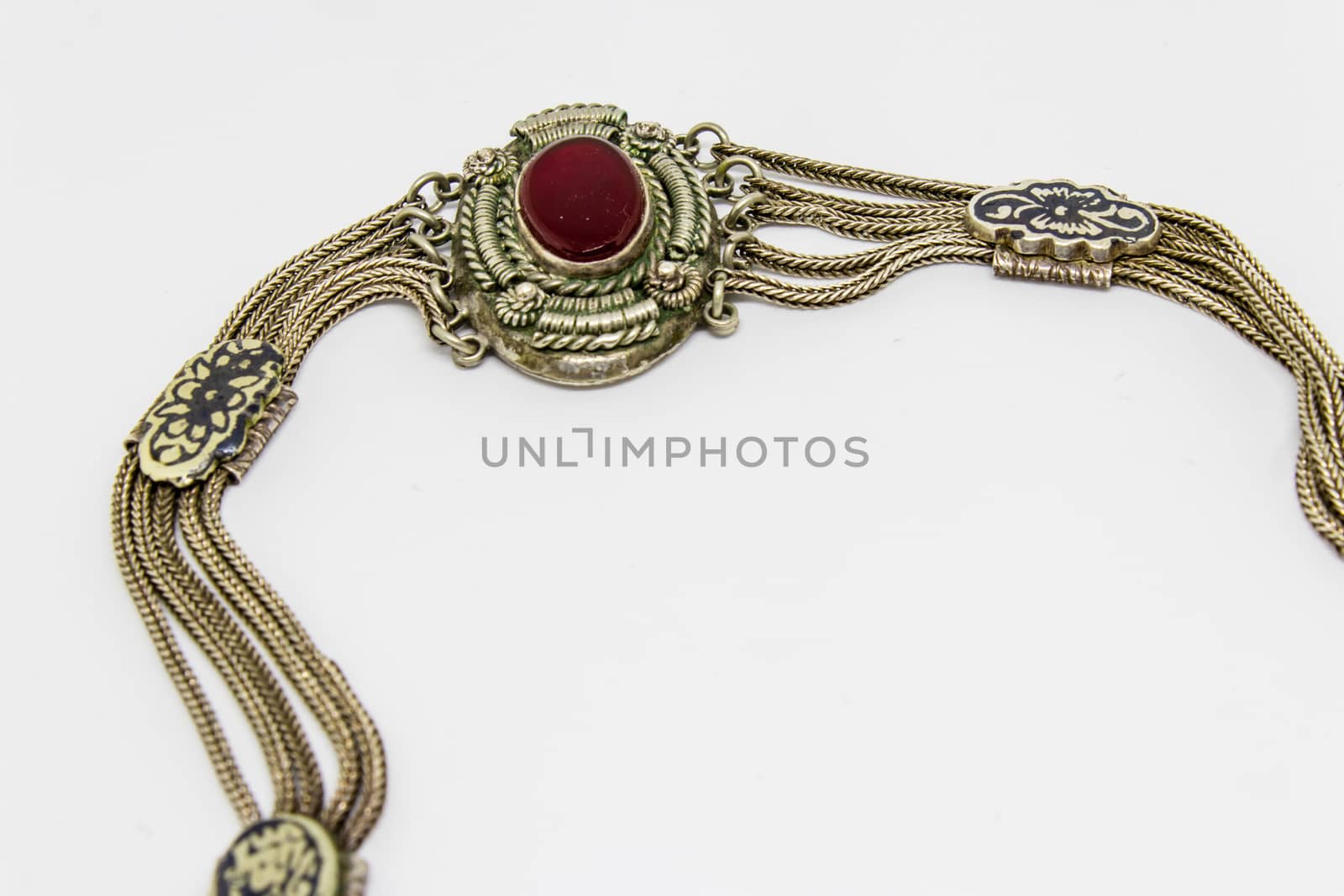 an isolated closeup shoot to antique silver bracelet with white background and many details.