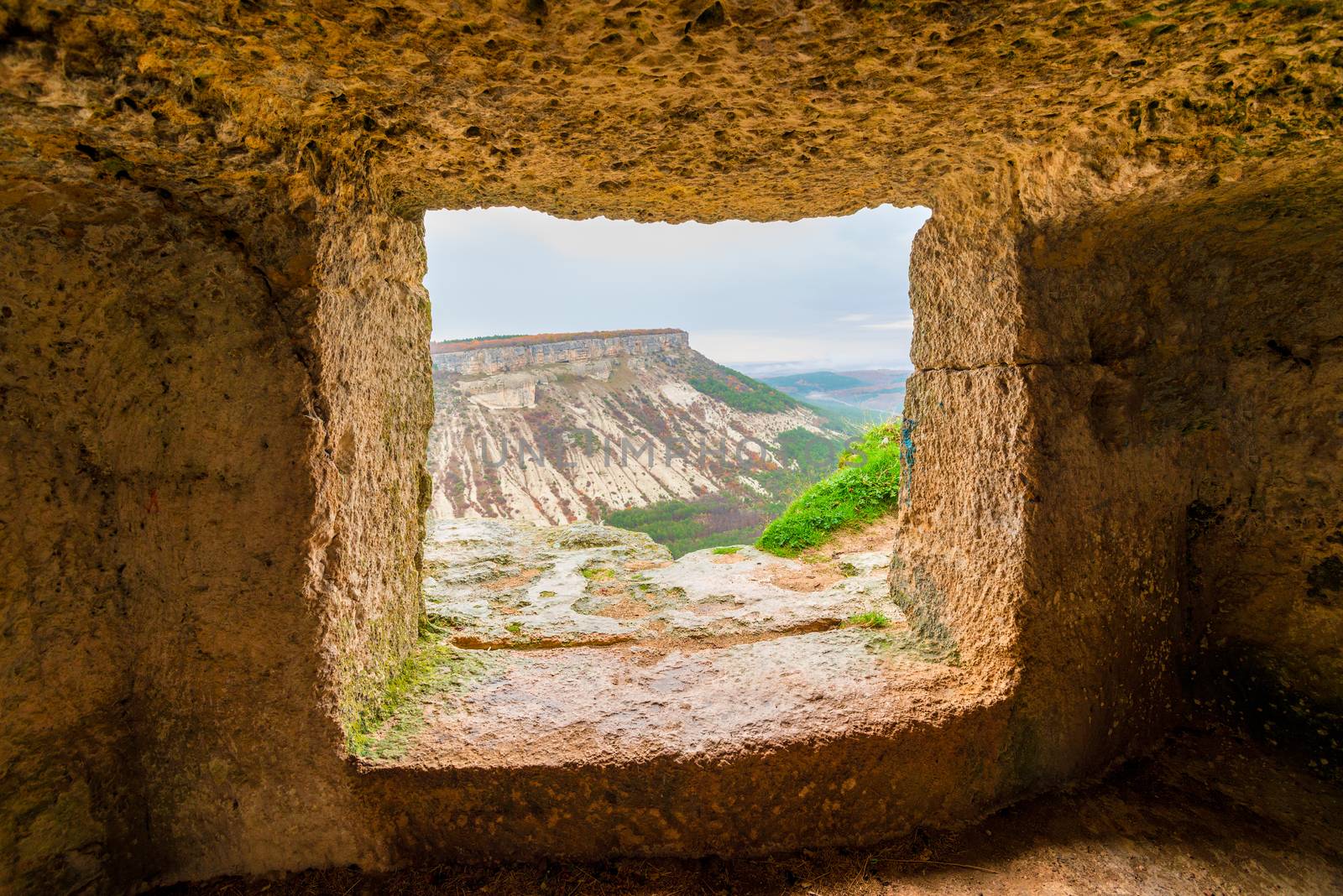 View of the mountain in the window of the cave city of Chufut-Ka by kosmsos111