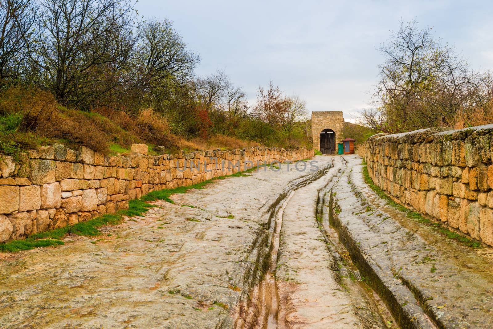 stone old road with deep gauge in the cave city of Chufut-Kale in Crimea, Russia