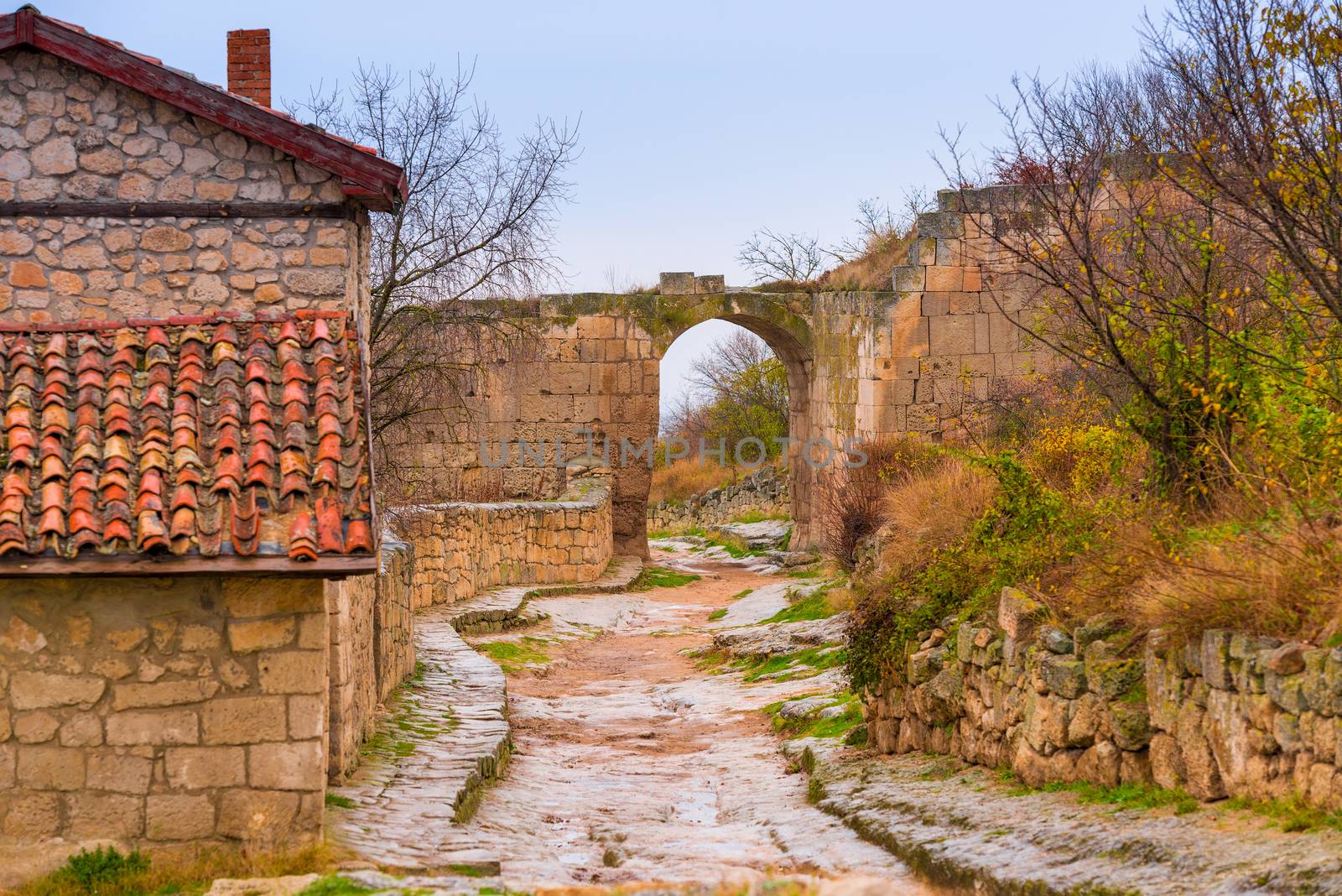 Cave city of Chufut-Kale in Crimea, view of the arch and the road