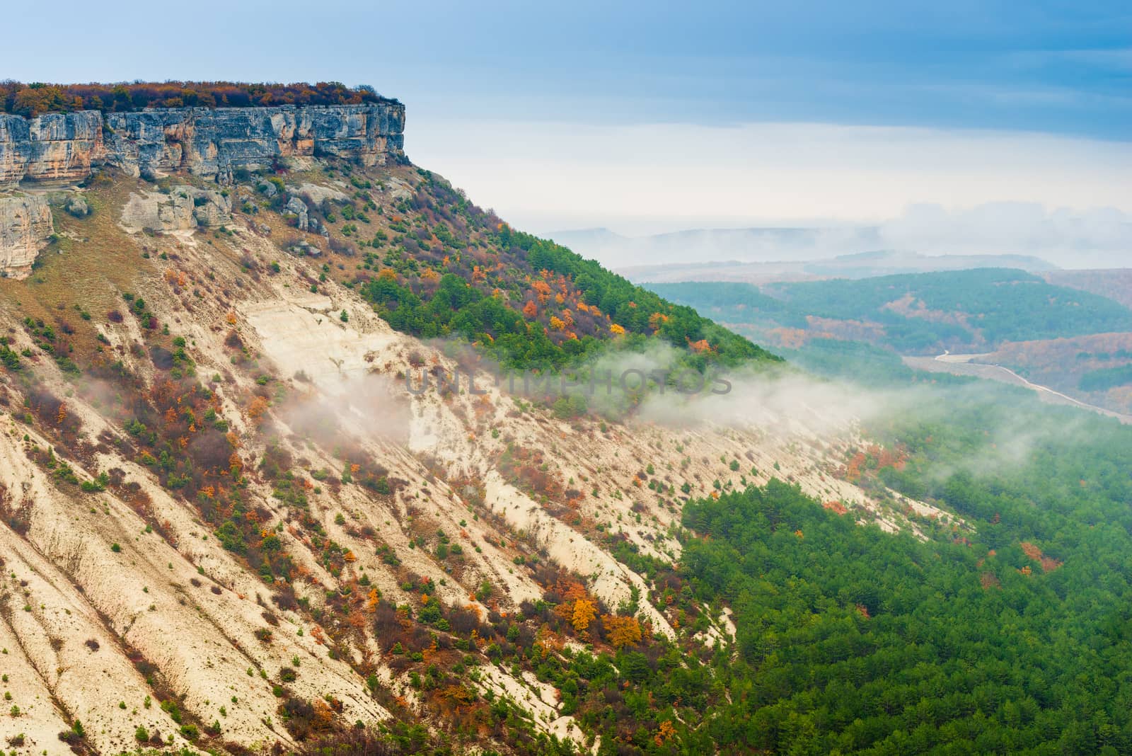 high mountaintops, a small cloud in the valley