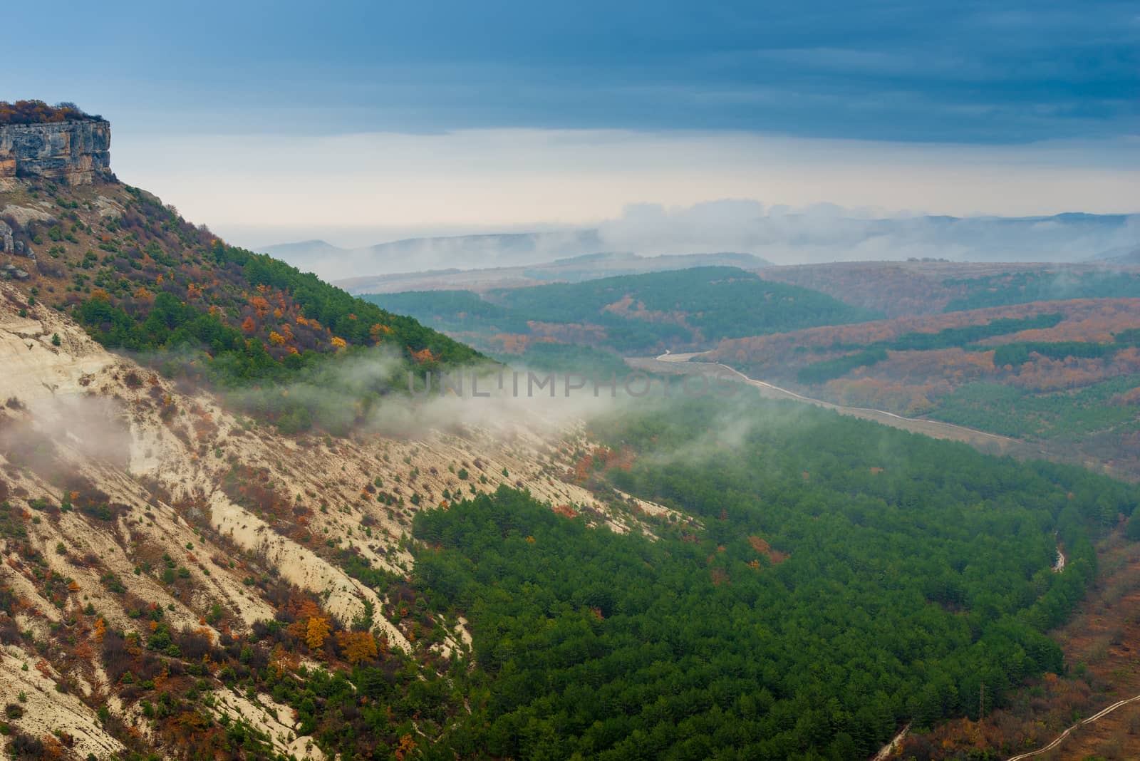 Cloudy autumn day, clouds over the valley