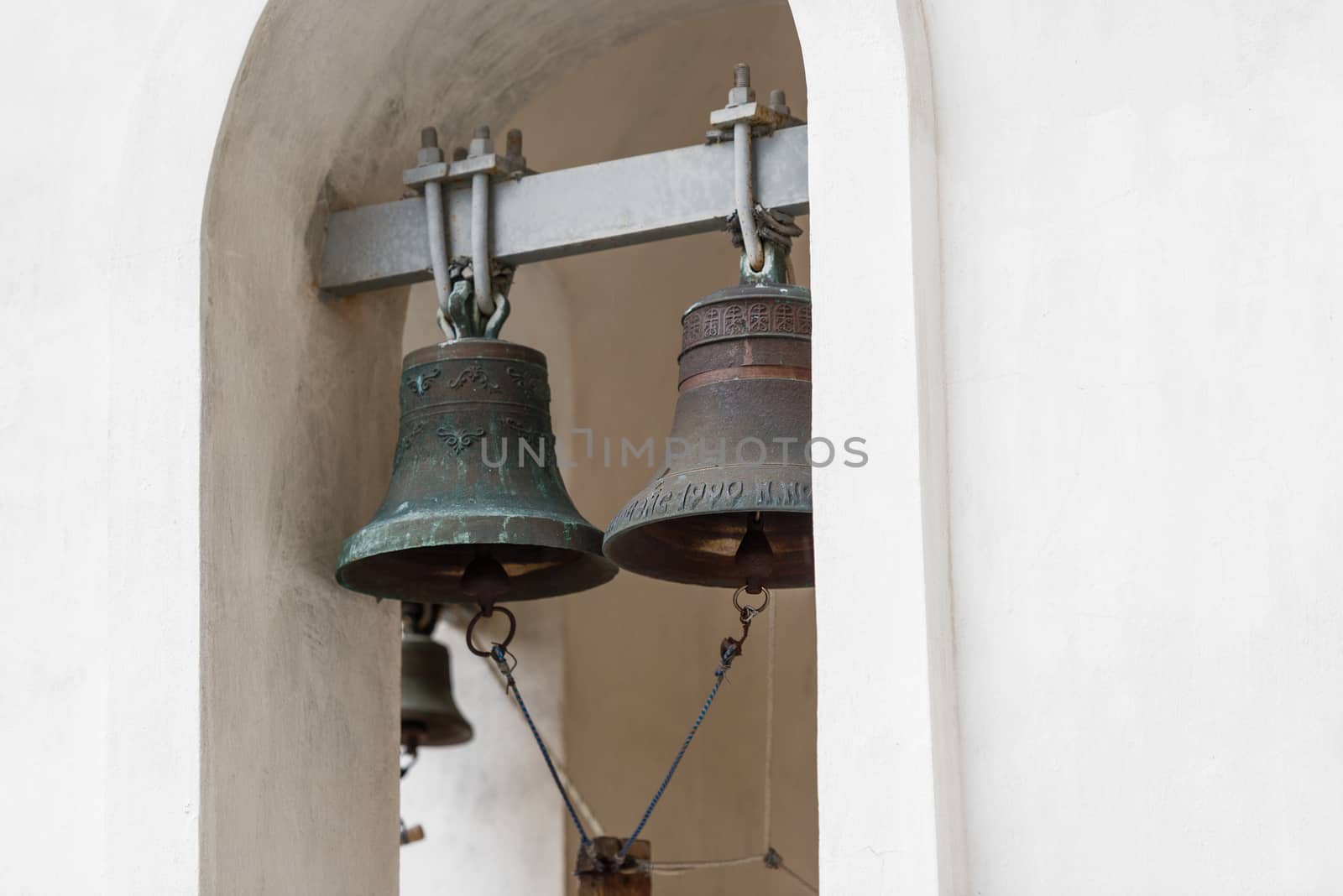 Large heavy bells in the belfry of the Orthodox Church of Russia