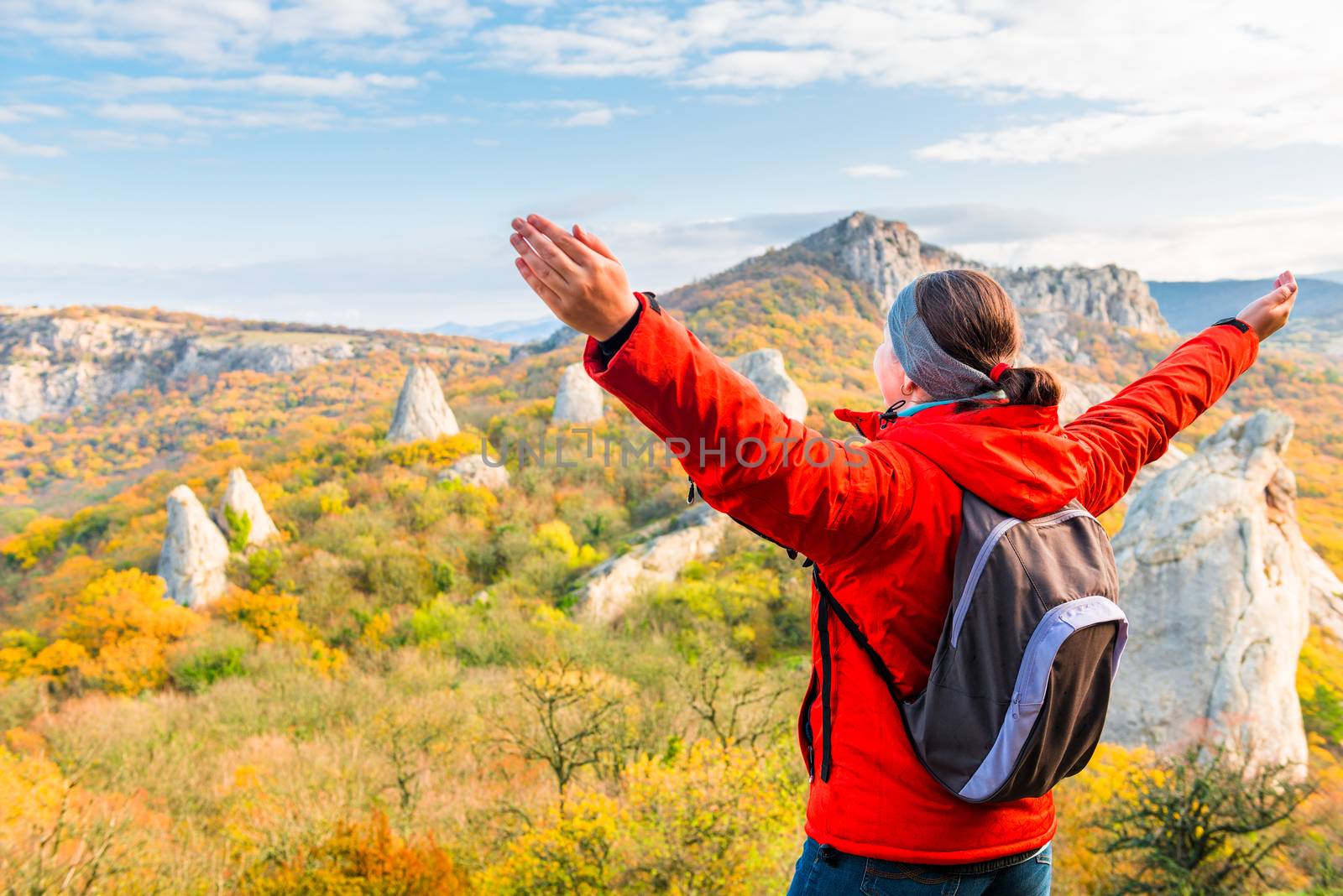 Hiking in the mountains, a traveler admiring the autumn mountain by kosmsos111