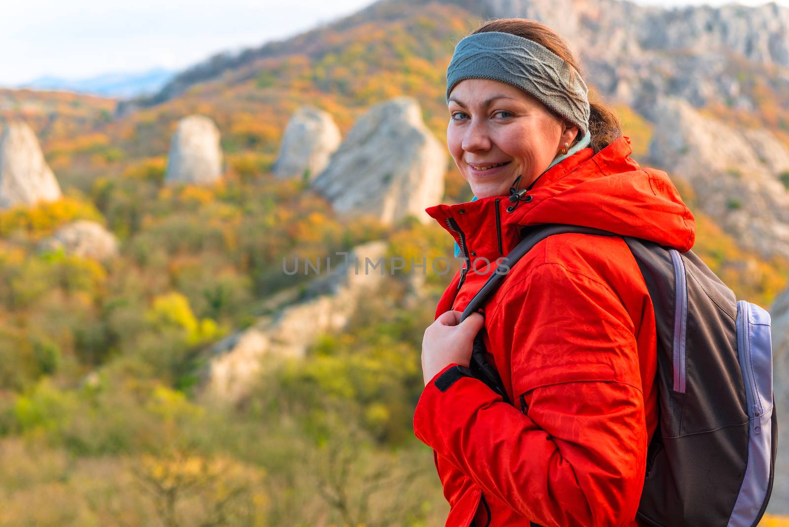 Happy woman tourist portrait in the autumn mountains by kosmsos111