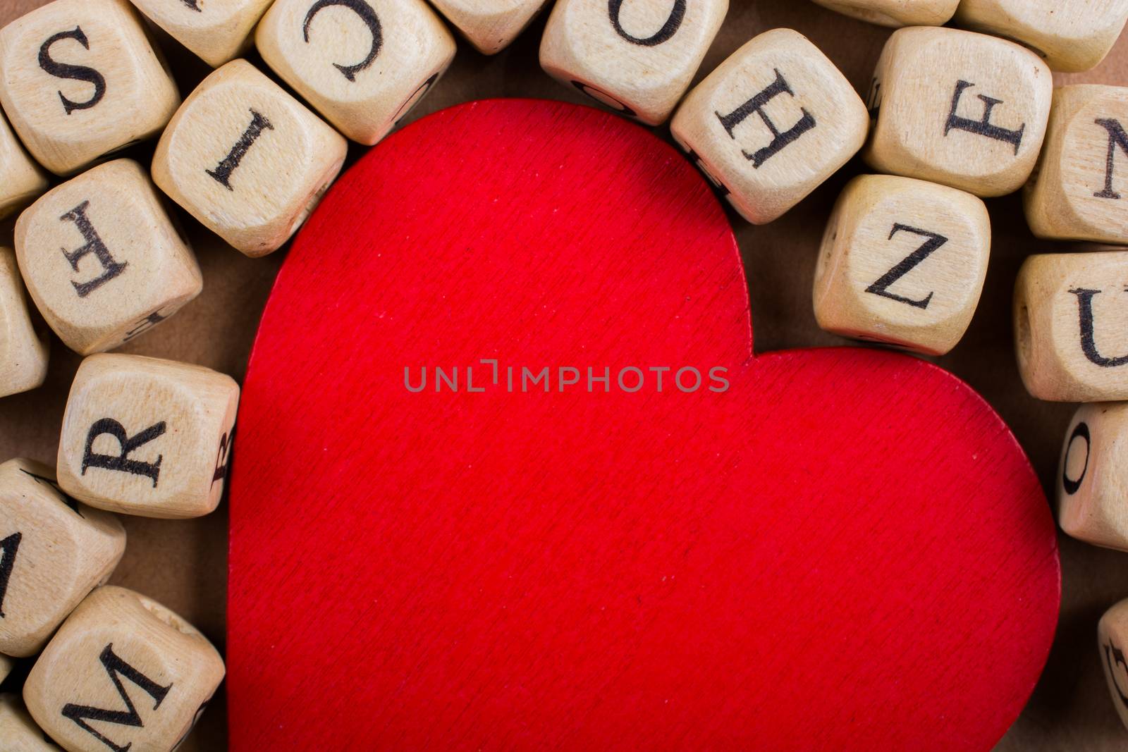 Red Love icon and Letter cubes of made of wood