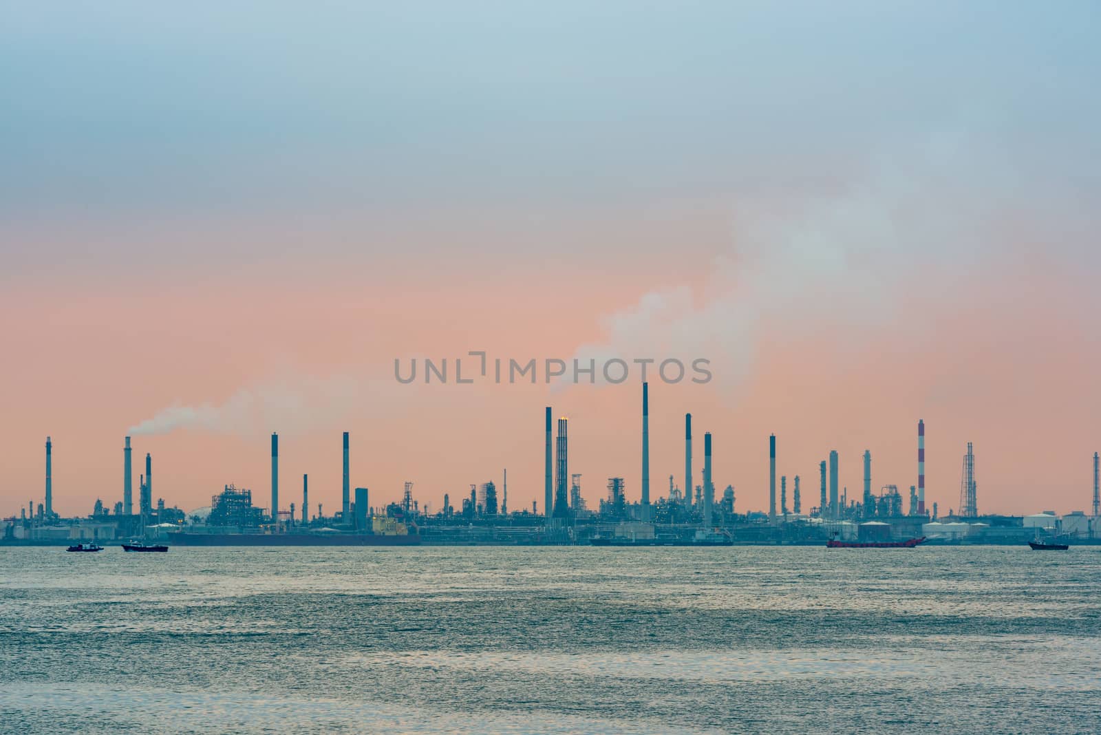 Oil refinery at sunset on Bukom Island in Singapore