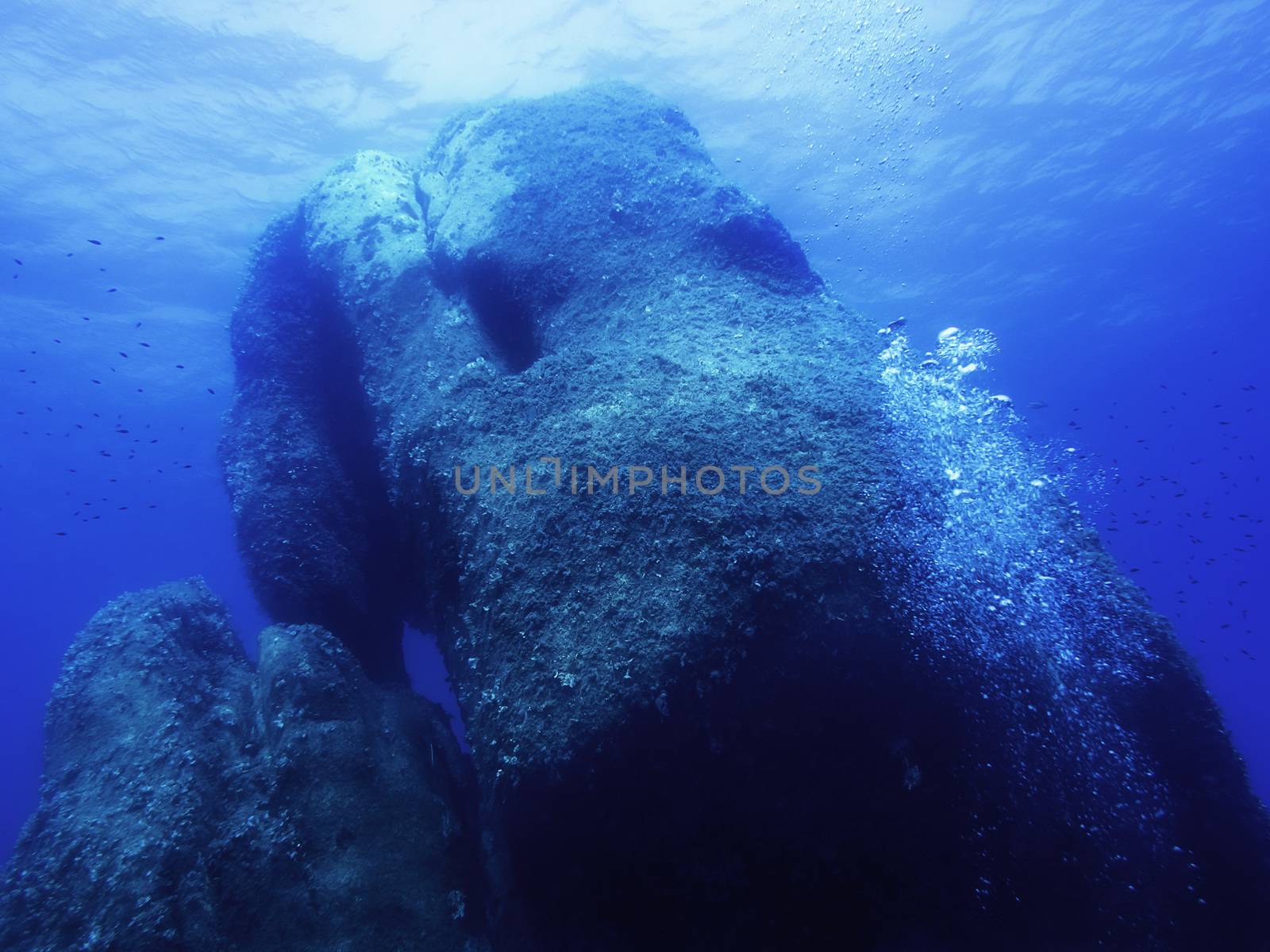 Background of a huge rock submerged in the sea by raulmelldo