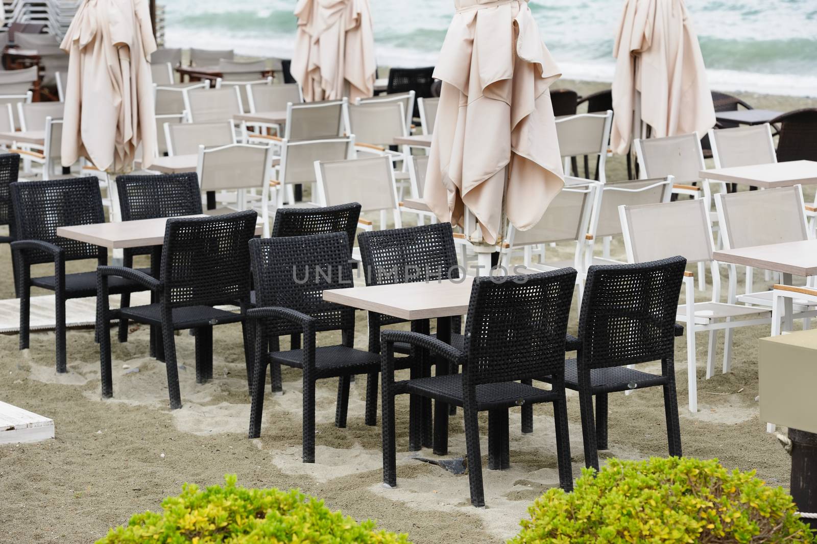 Empty beach outdoor cafe at low season with bad weather with no people. Leptokaria, Makedonia, Greece