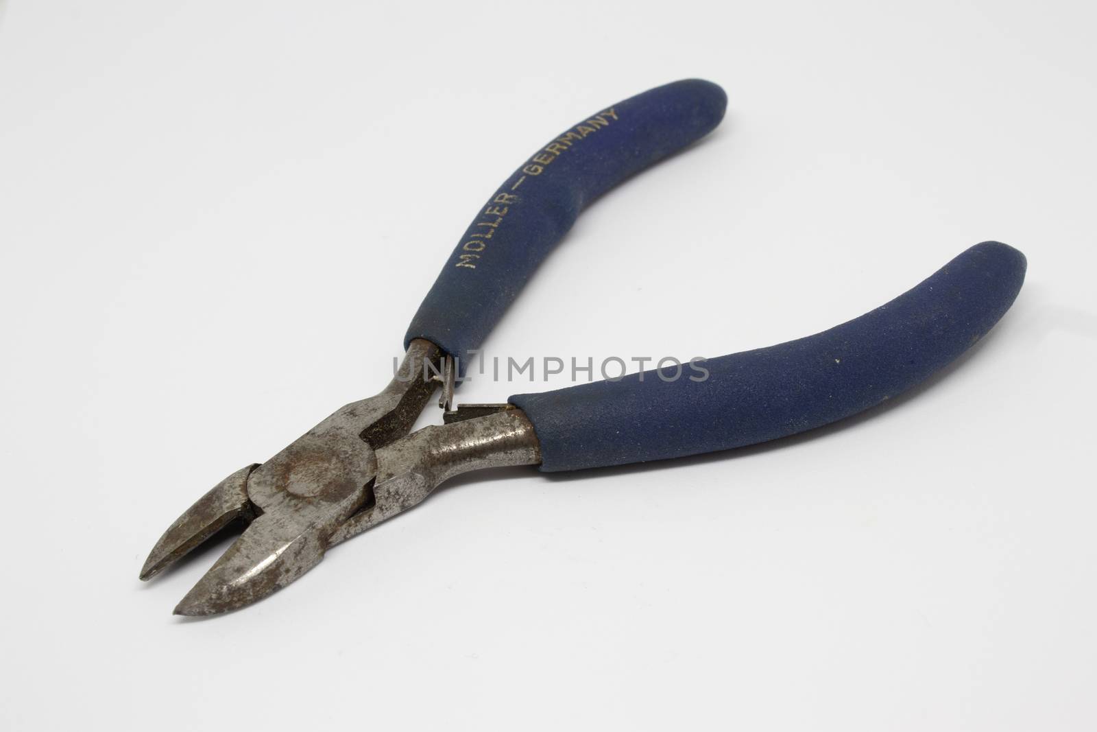 a pair of pincers with blue handle closeup shoot. photo has taken with photobox with white background.