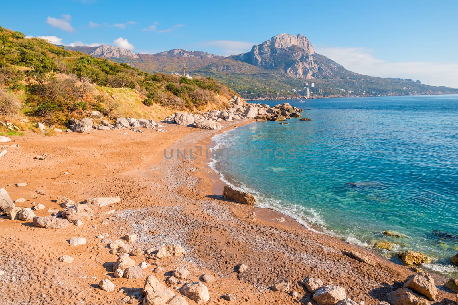 View of the sandy beach and the rocky coast of the Black Sea, the landscape of the Crimea