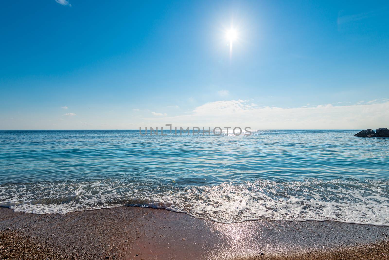 calm blue sea water and bright sun above the horizon by kosmsos111