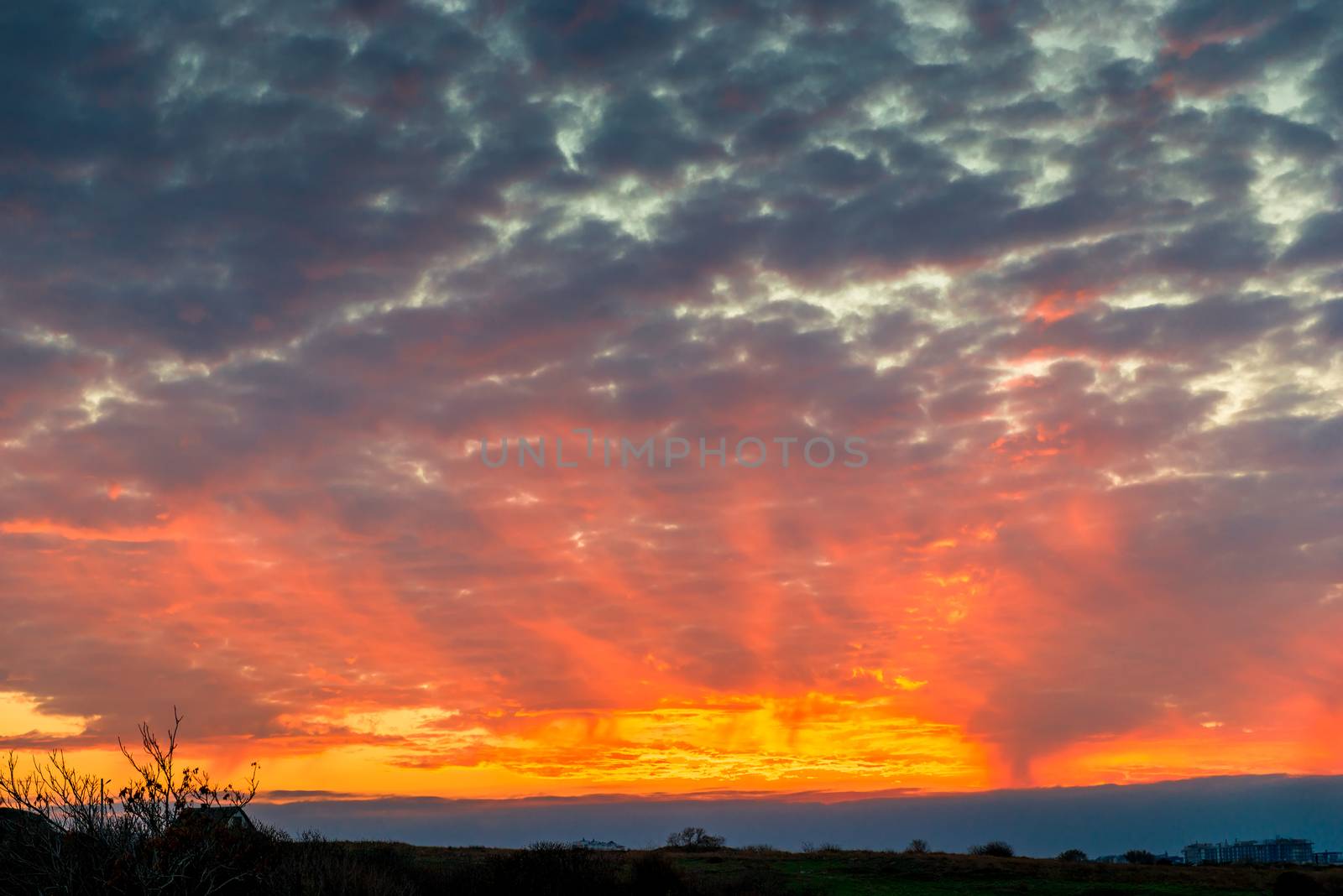 Beautiful picturesque sky orange clouds at sunset