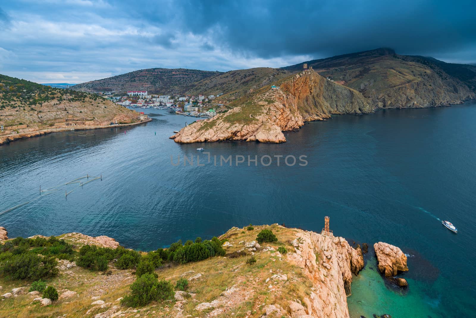 Scenic landscape view of the bay, mountains and dramatic sky before the rain