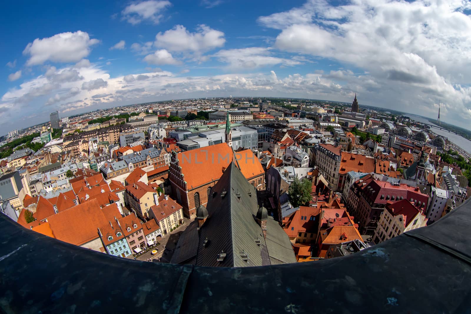 Fisheye aerial view of Riga city from st. Peter's church in Latvia. Panoramic view of Riga with cloudy blue sky. Fisheye lens.