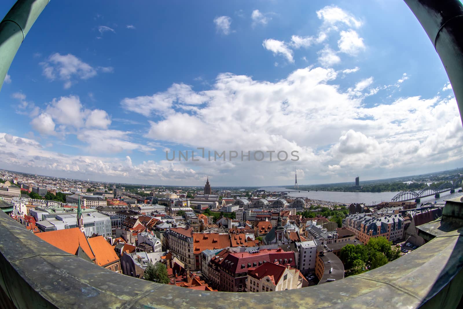 Fisheye aerial view of Riga city from st. Peter's church in Latvia. Panoramic view of Riga with cloudy blue sky. Fisheye lens.