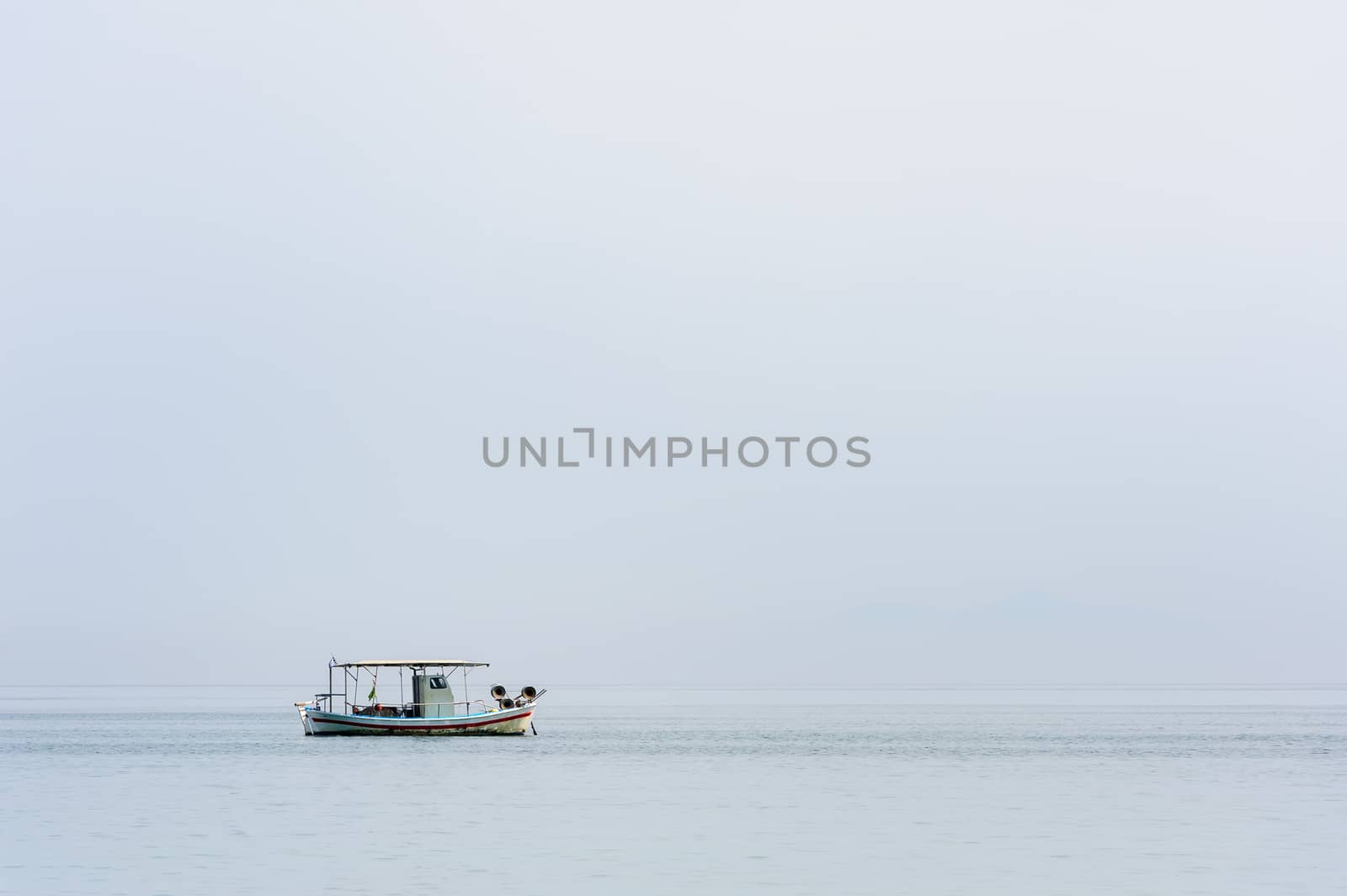 Two small white fishing boat at sea surface