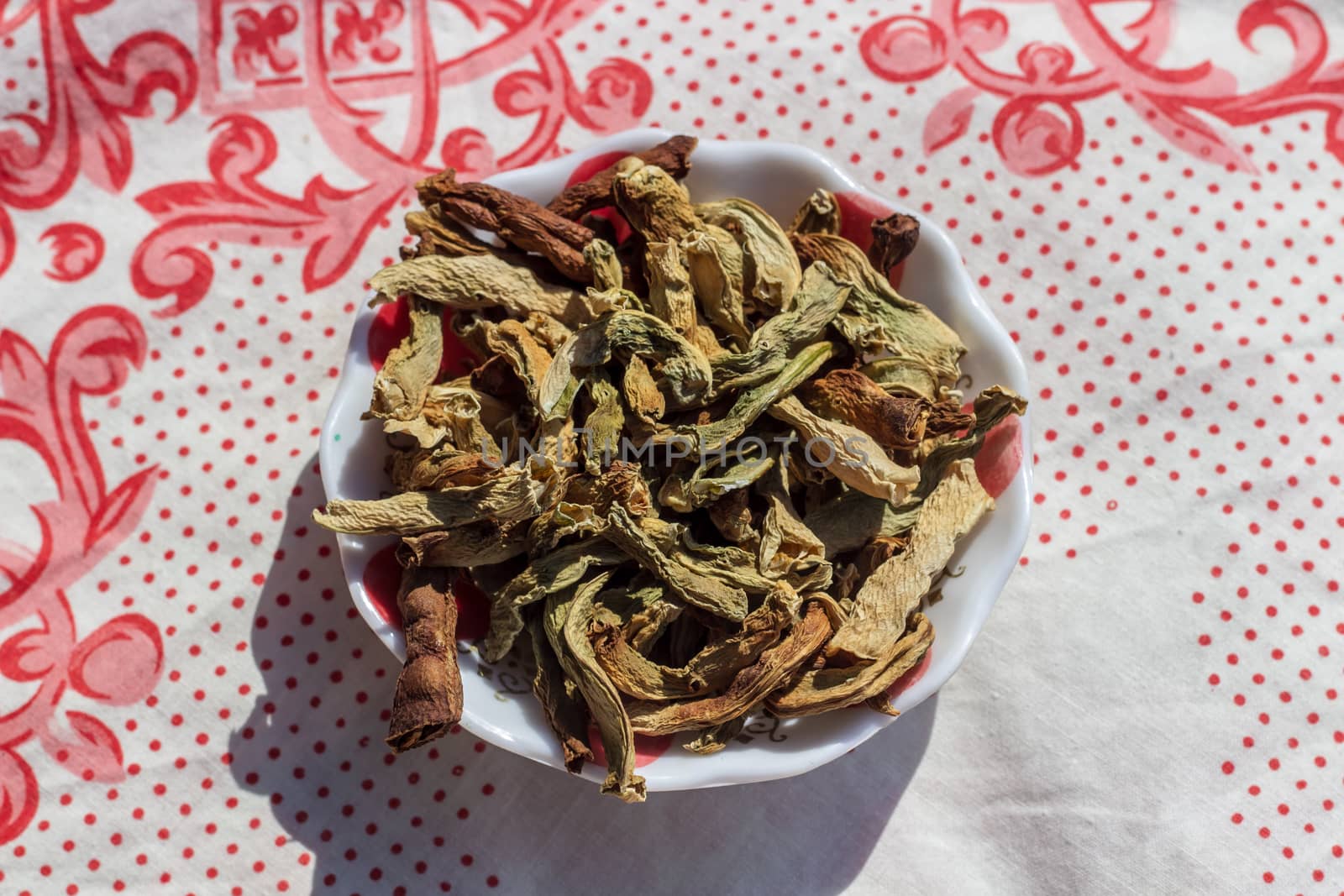 a closeup food shoot to dried peppers with round bowl. photo has taken at a village at turkey.