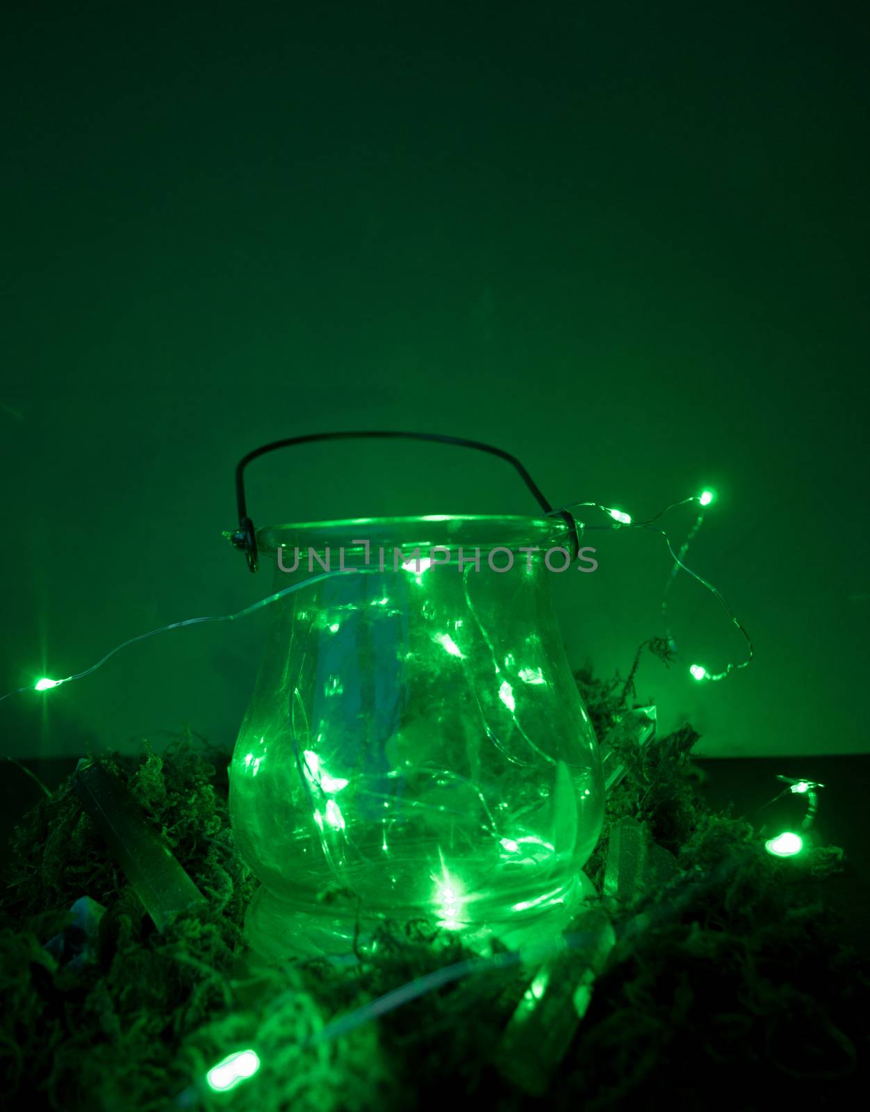 Magic cauldron, green background, moss, firefly, fog smoke bokeh close-up