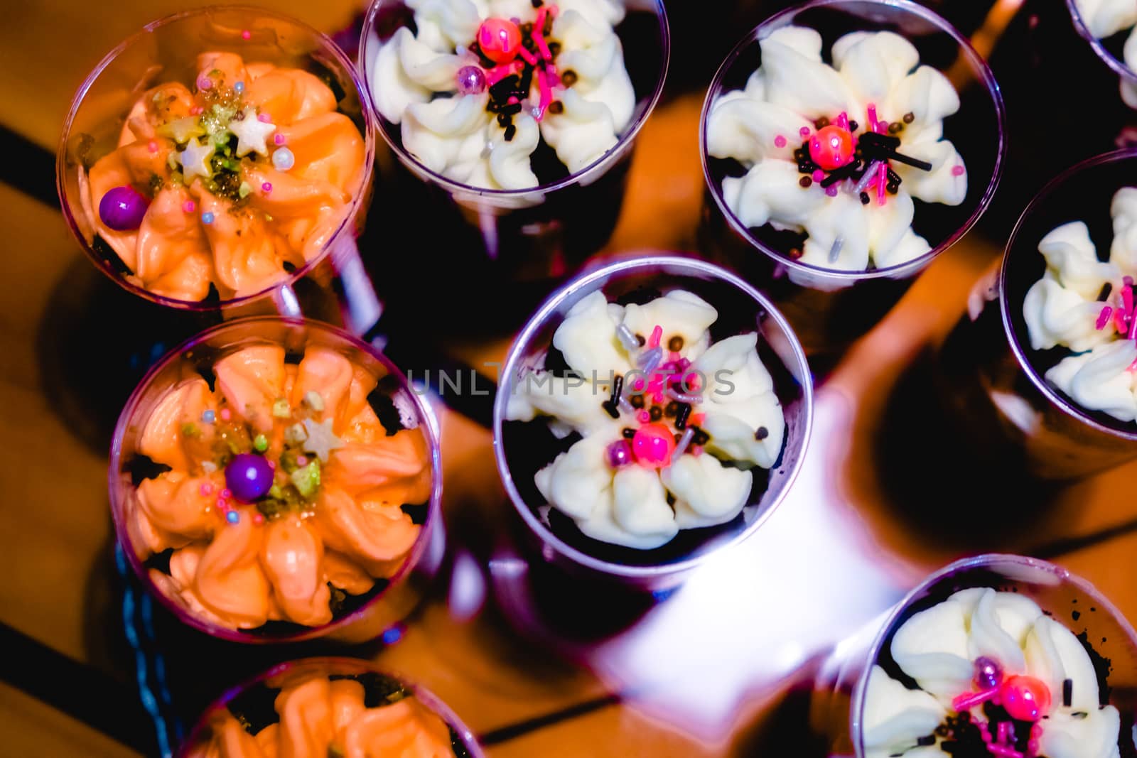 glasses with dessert-cream and sprinkles