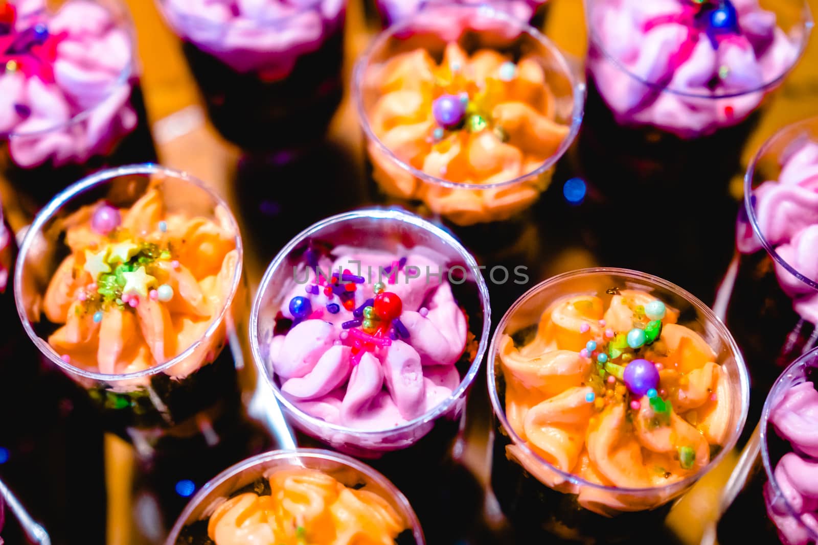 glasses with dessert-cream and sprinkles
