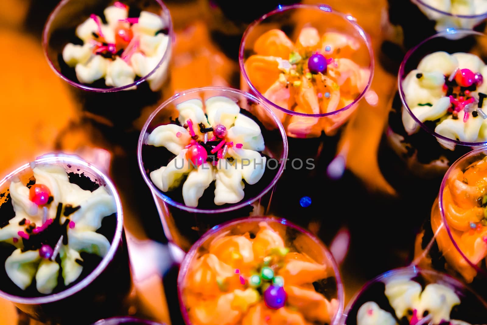 glasses with dessert-cream and sprinkles